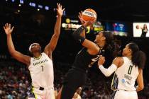 Las Vegas Aces forward A'ja Wilson (22) shoots a layup as Dallas Wings center Teaira McCowan (7 ...