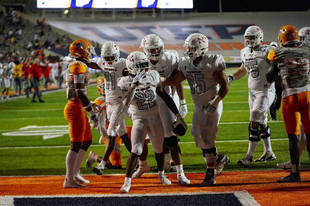 UNLV running back Jai'Den Thomas notes his fourth touchdown of the game against Texas-El Paso o ...