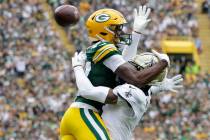 New Orleans Saints cornerback Alontae Taylor breaks up a pass intended for Green Bay Packers wi ...