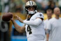 New Orleans Saints quarterback Derek Carr (4) warms up before an NFL football game against the ...