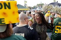 New Orleans Saints fan Melissa Taber, of Memphis, enjoys tailgating festivities with Green Bay ...