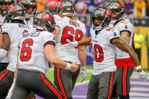 Tampa Bay Buccaneers wide receiver Trey Palmer celebrates with teammate quarterback Baker Mayfi ...