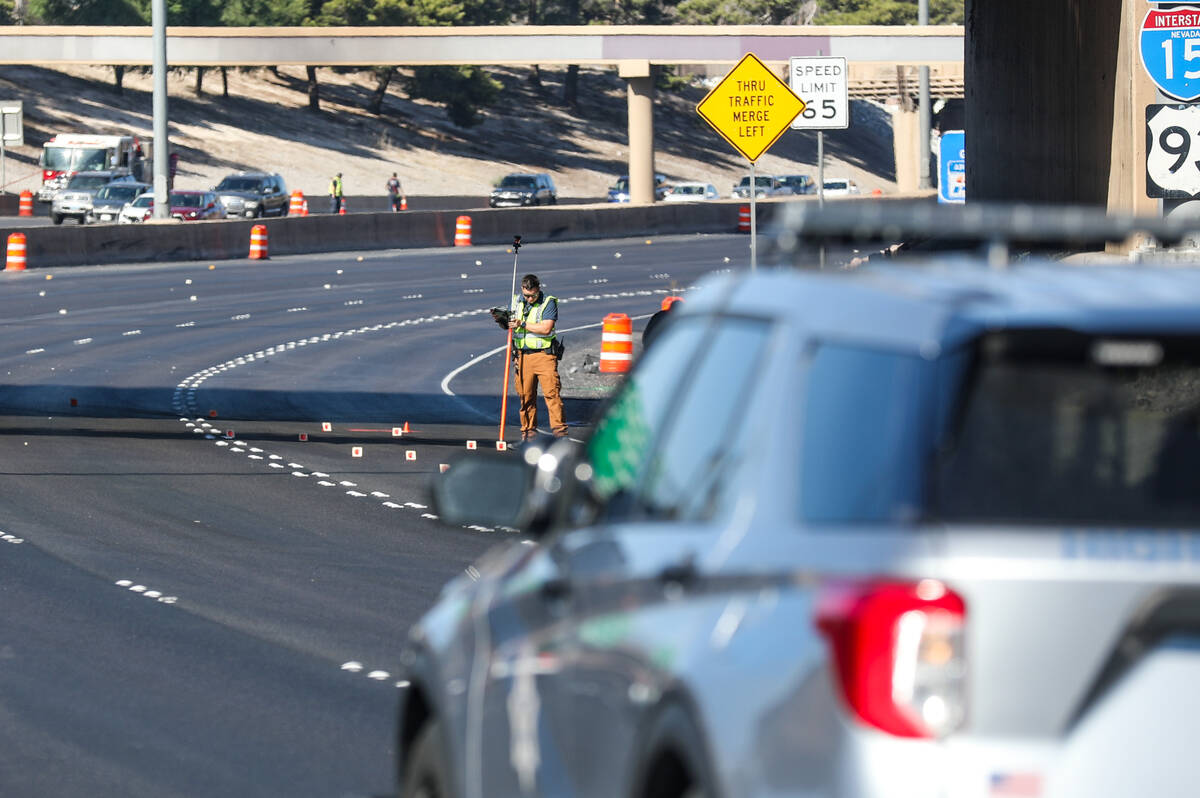 Investigators work the scene of a fatal pedestrian crash on northbound Interstate 15 south of L ...
