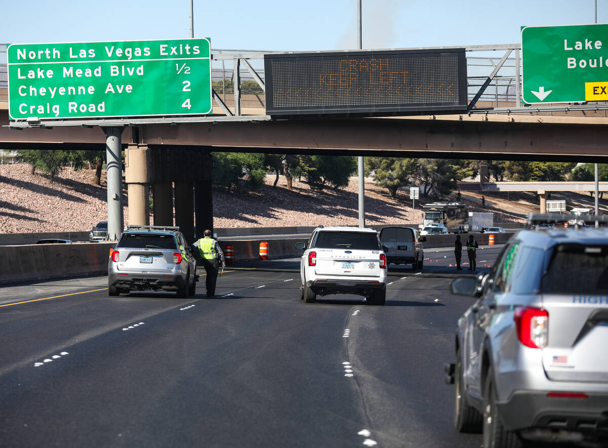 Investigators work the scene of a fatal pedestrian crash on northbound Interstate 15 south of L ...