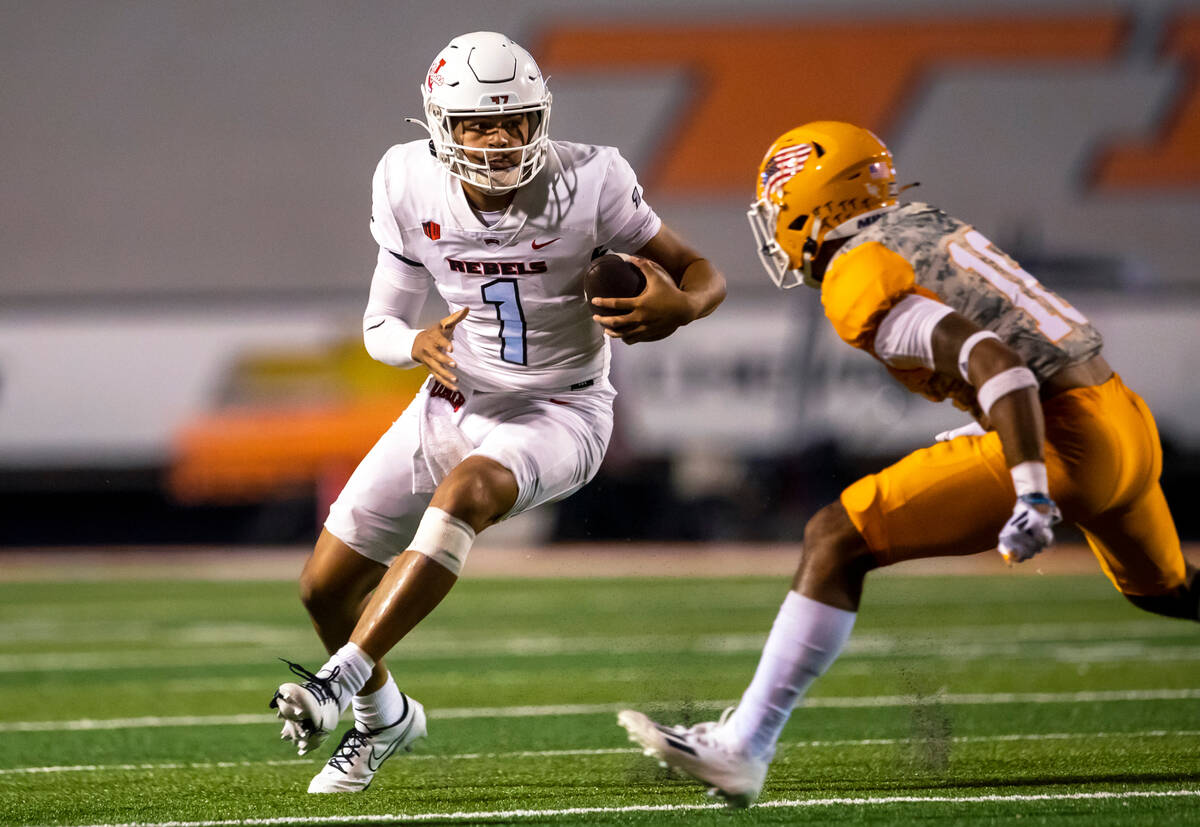 UNLV quarterback Jayden Maiava (1) tries to elude UTEP safety Tyler Williams during the second ...