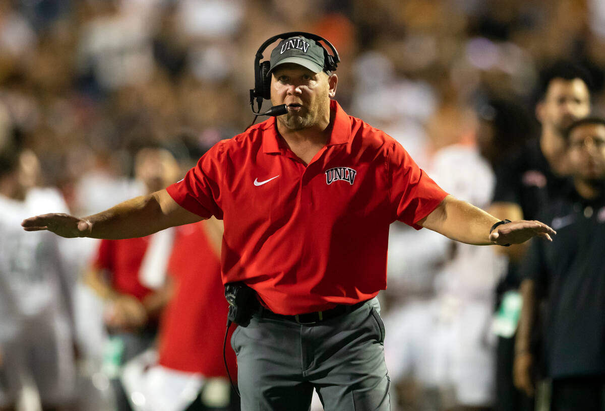 UNLV coach Barry Odom gestures from the sidelines during an NCAA college football game against ...