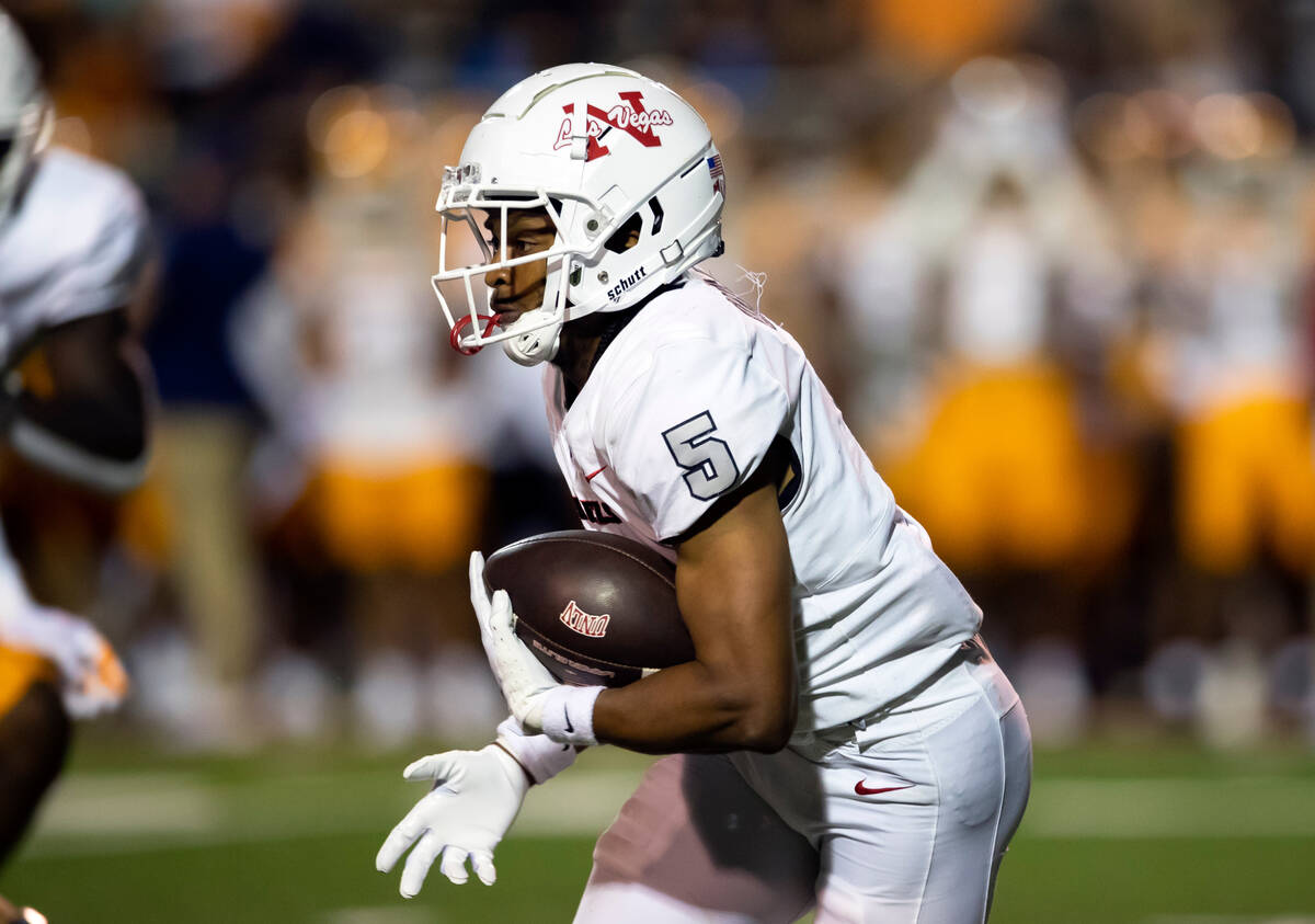 UNLV running back Vincent Davis Jr. runs for yardage against UTEP during an NCAA college footba ...