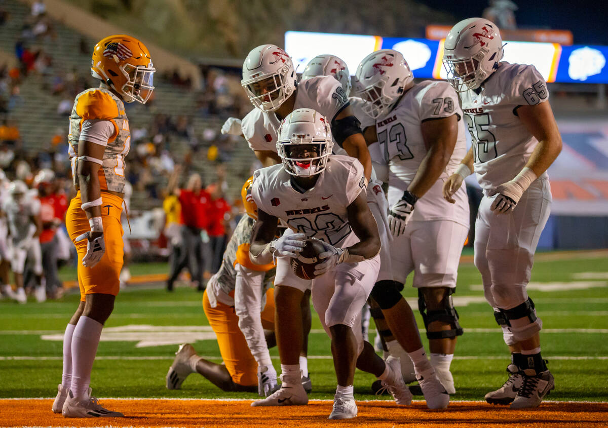 UNLV running back Jai'Den Thomas (22) scores his fourth touchdown against UTEP during the secon ...