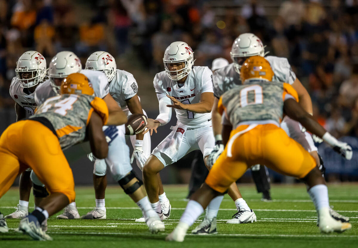 UNLV quarterback Jayden Maiava (1) takes the snap during an NCAA college football game against ...