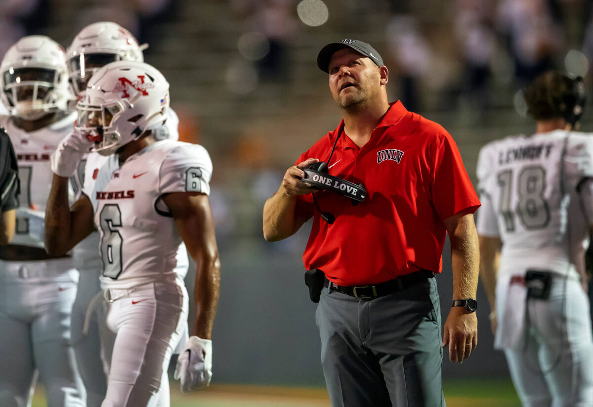 UNLV coach Barry Odom looks at the scoreboard during a time out in the second half of an NCAA c ...