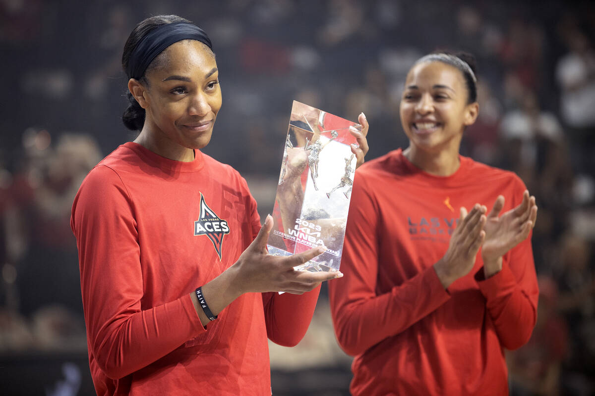 Las Vegas Aces forward A'ja Wilson accepts her award for WNBA Defensive Player of the Year alon ...