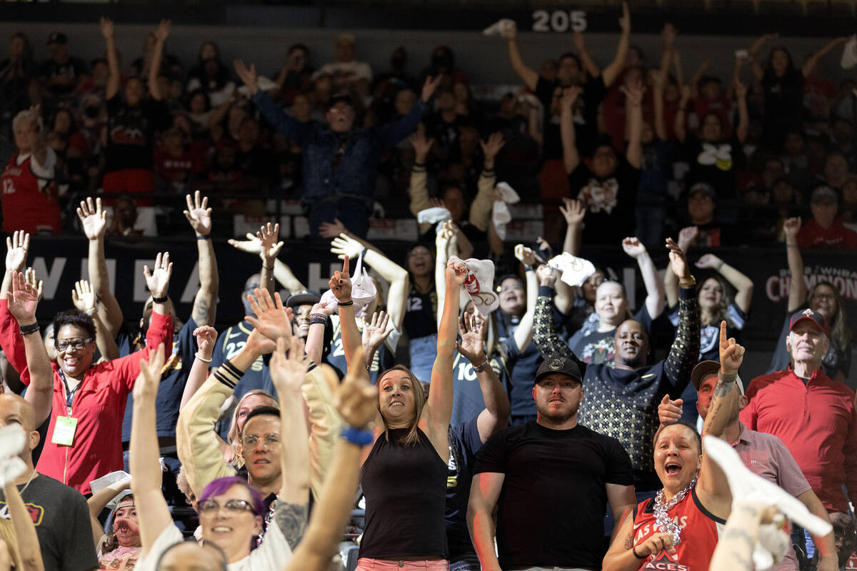 Las Vegas Aces fans cheer with the hope of getting a free t-shirt during the first half in Game ...