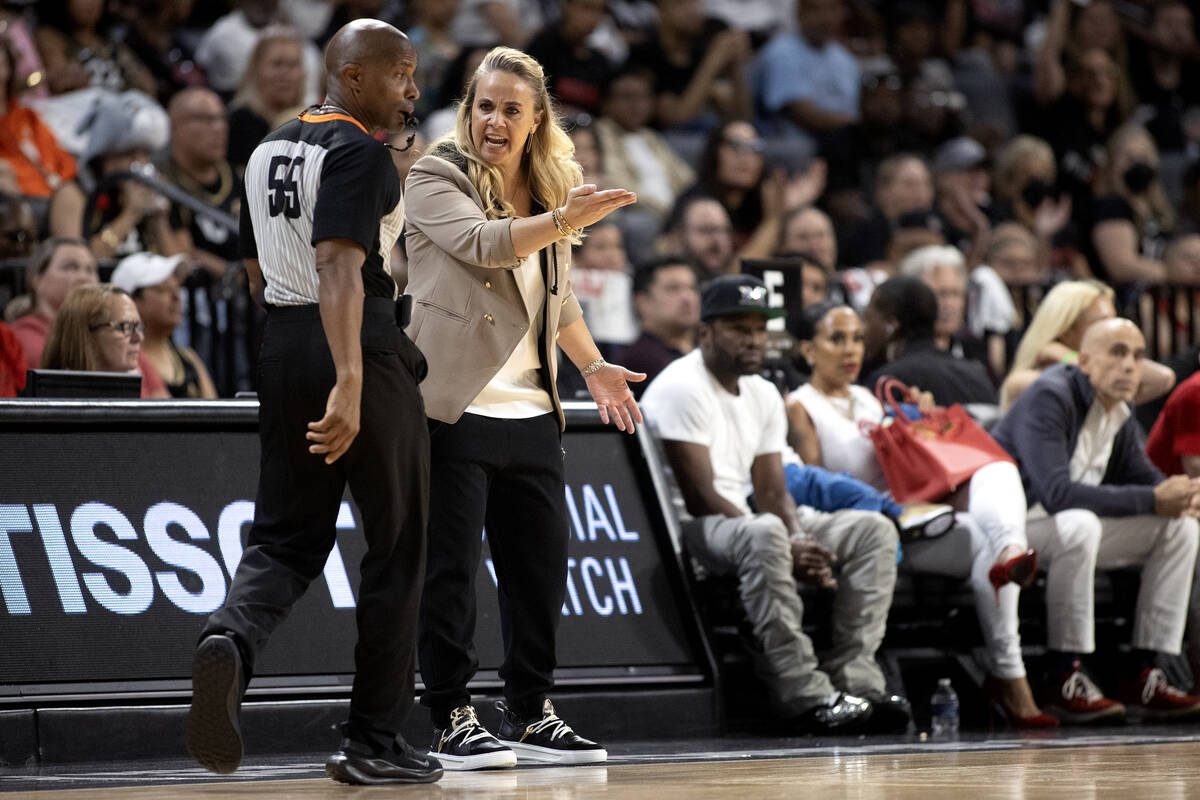 Las Vegas Aces head coach Becky Hammon disputes a foul called by referee Eric Brewton (55) duri ...