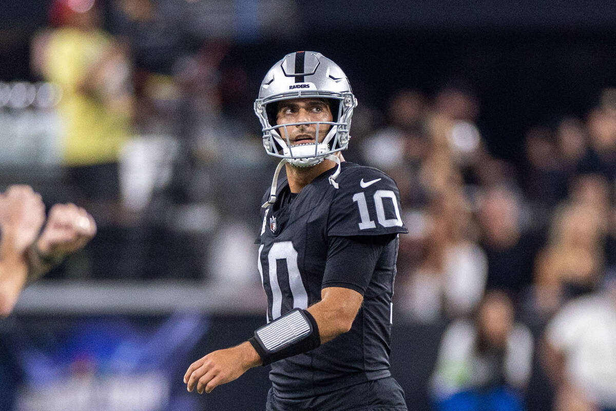 Raiders quarterback Jimmy Garoppolo (10) walks off the field after another stalled drive agains ...
