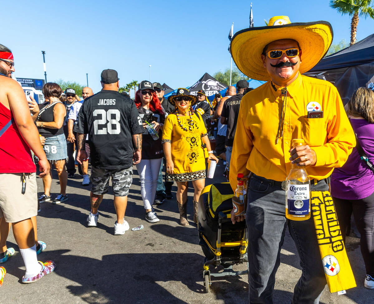 Pittsburgh Steelers fans bring their music with them during tailgating before the first half of ...