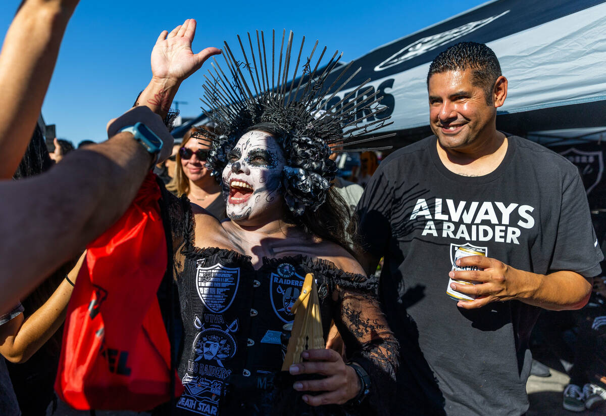 Catrina Raider, middle, during tailgating before the first half of the Raiders versus Pittsburg ...