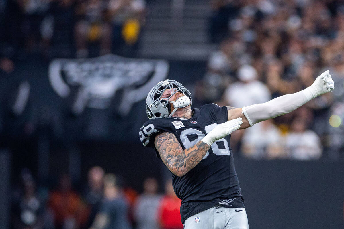 Raiders defensive end Maxx Crosby (98) is pumped up after a sack on Pittsburgh Steelers quarter ...