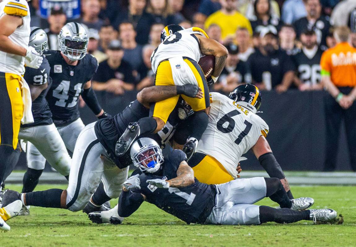 Raiders defensive tackle John Jenkins (95) tackles Pittsburgh Steelers running back Jaylen Warr ...