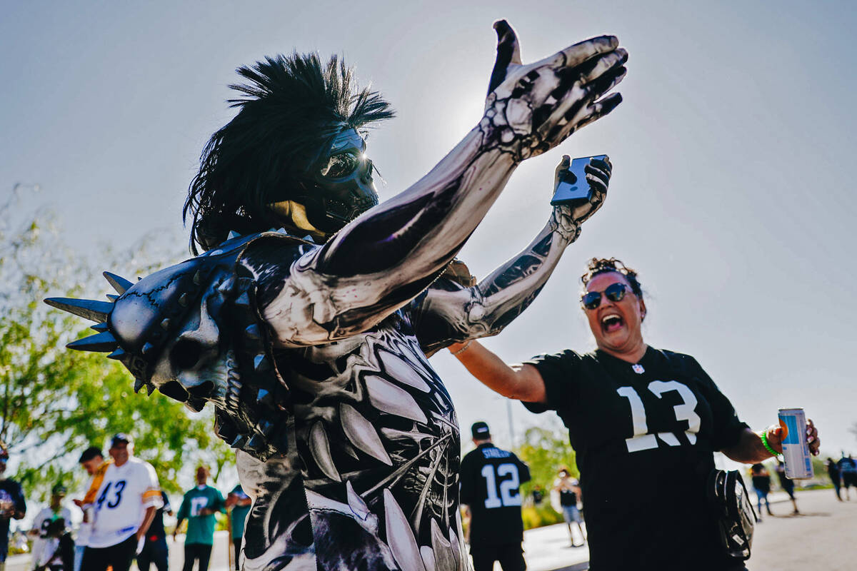 Raiders fan Robert Lee dances at a tailgate before an NFL football game against the Pittsburgh ...