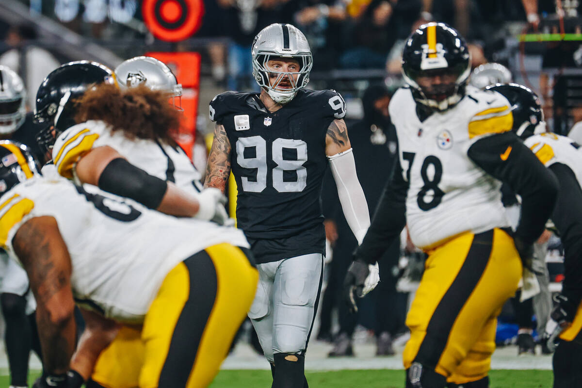 Raiders defensive end Maxx Crosby (98) gets into formation during the first half of a game agai ...