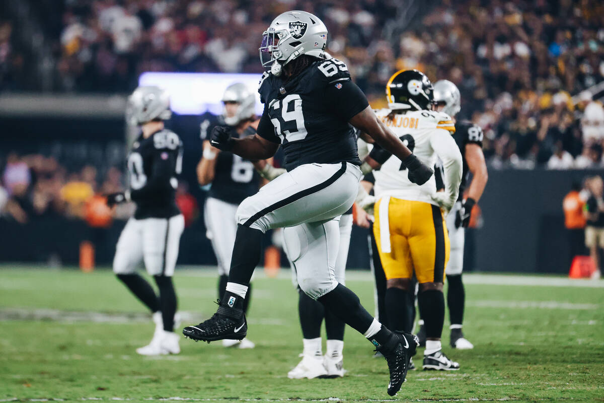 Raiders defensive tackle Adam Butler (69) celebrates a flag on a Pittsburgh Steelers play durin ...