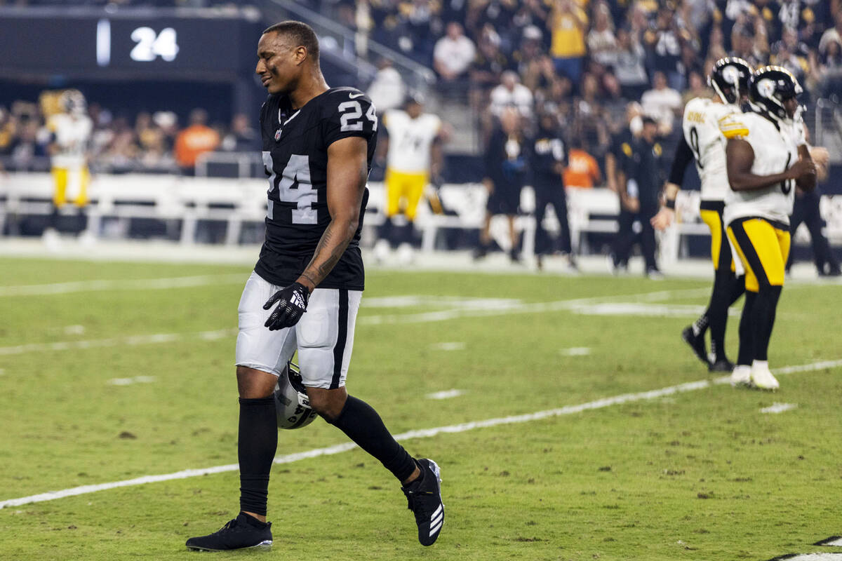 Raiders cornerback Marcus Peters (24) reacts after Pittsburgh Steelers tight end Pat Freiermuth ...