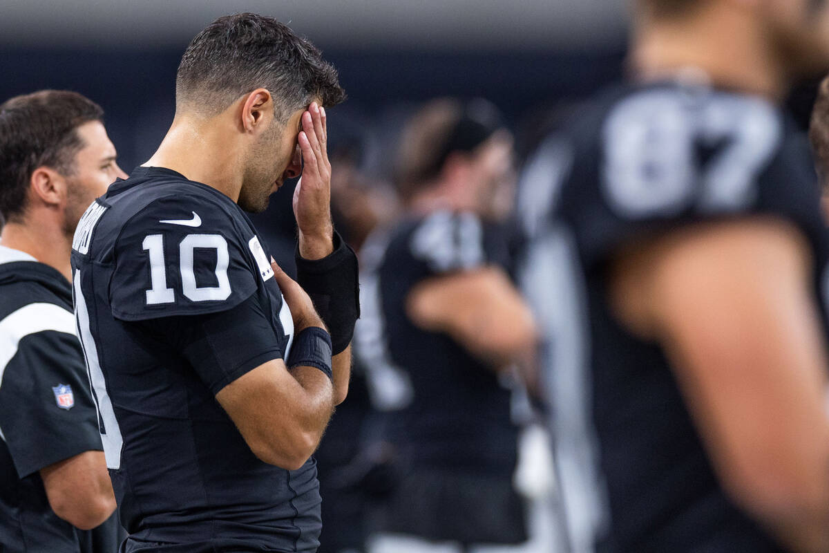 Raiders quarterback Jimmy Garoppolo (10) has his hand on his face and the other on his heart on ...