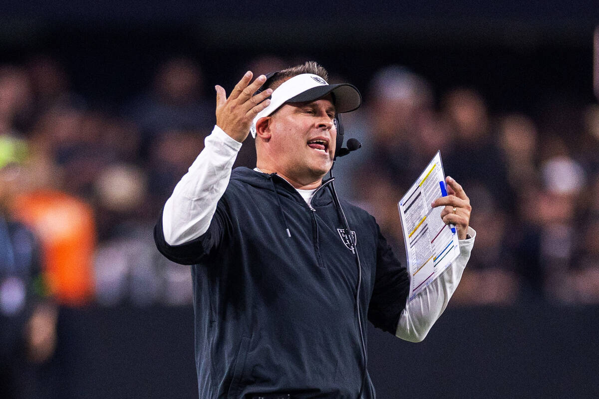 Raiders Head Coach Josh McDaniels argues with a referee after another penalty in favor of the P ...