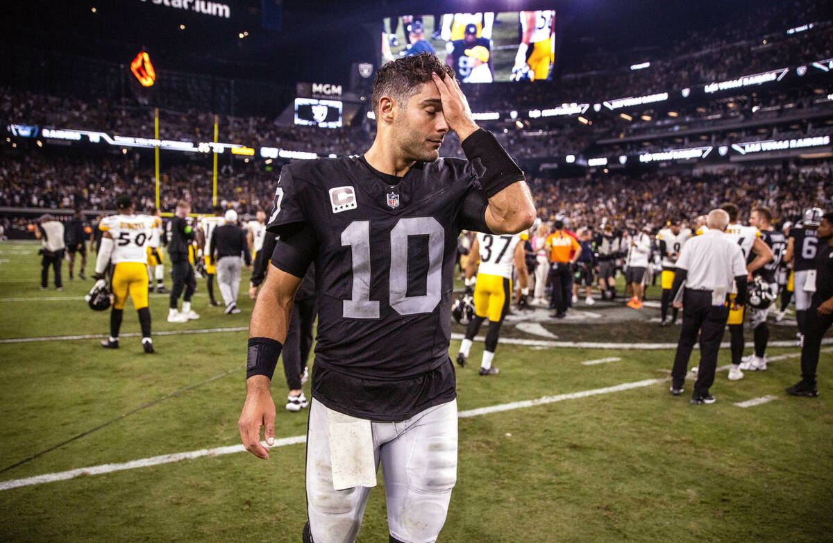 Raiders quarterback Jimmy Garoppolo (10) walks off the field following a tough night's loss to ...