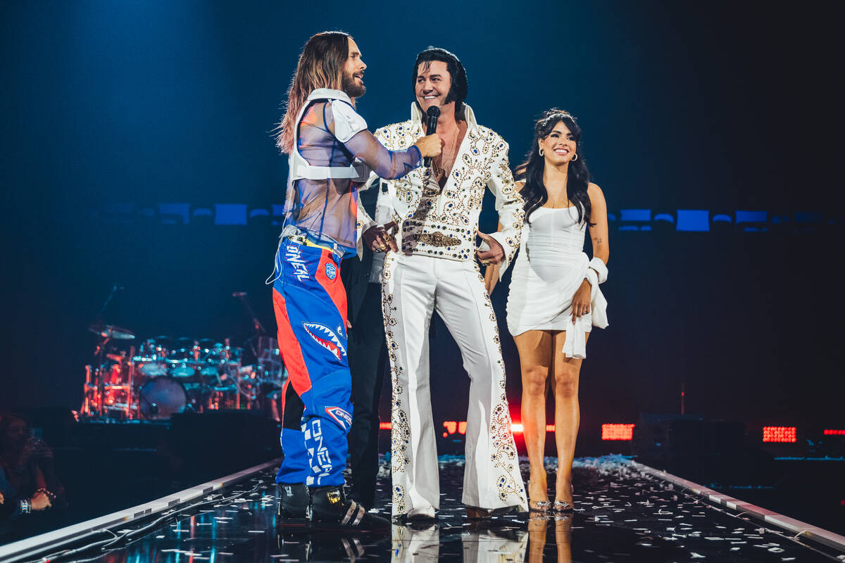 Jared Leto is shown with Elvis tribute artist Travis Allen and Las Vegas model April Ocegueda a ...