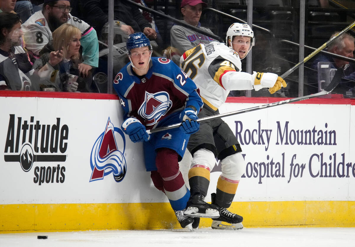 Colorado Avalanche right wing Oskar Olausson, left, collides with Vegas Golden Knights left win ...