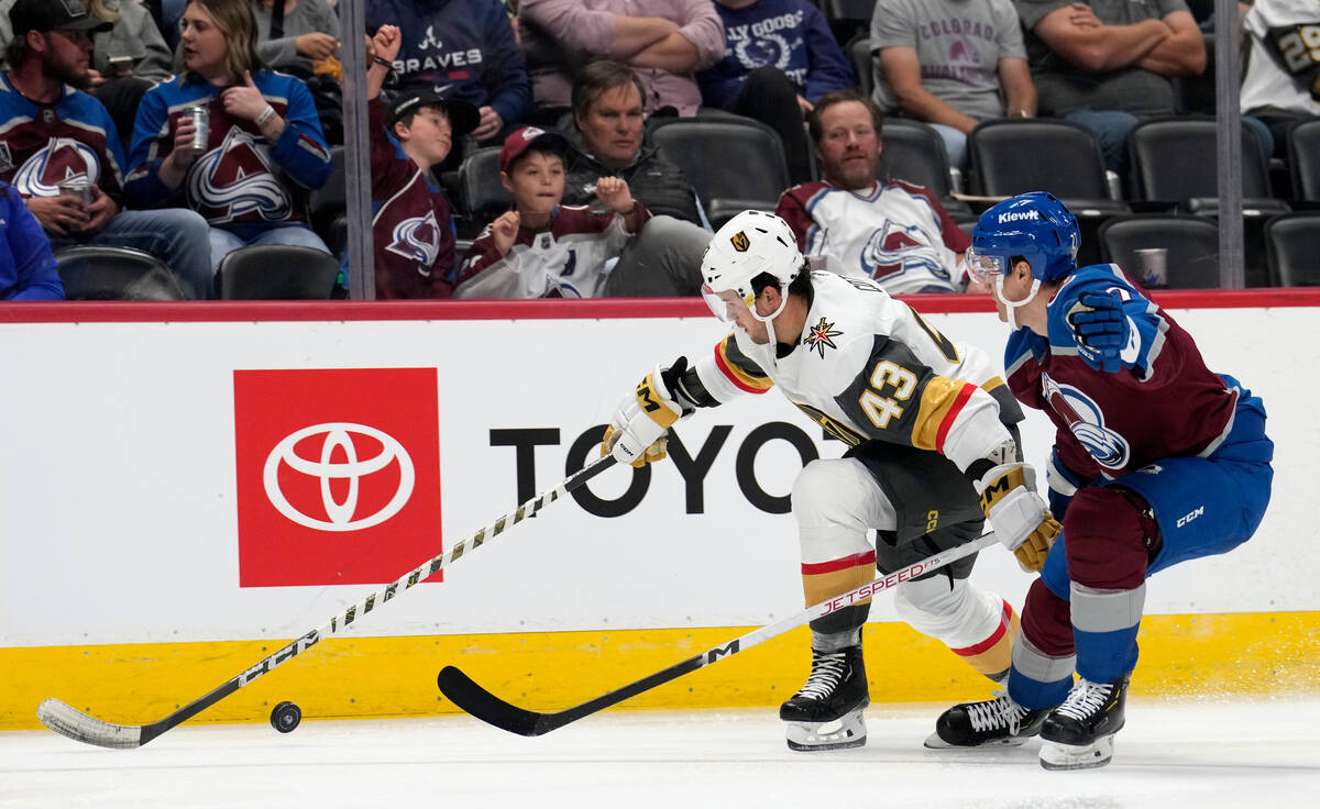 Vegas Golden Knights center Paul Cotter, left, fights for control of the puck with Colorado Ava ...
