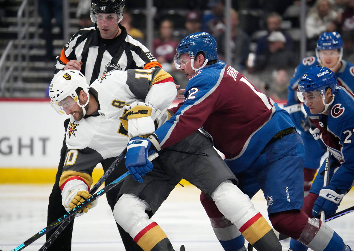 Vegas Golden Knights center Nicolas Roy, left, fights for control of the puck with Colorado Ava ...