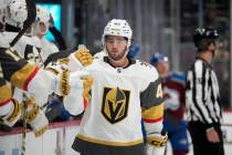 Vegas Golden Knights defenseman Luke Cormier is congratulated as he passes the team box after s ...