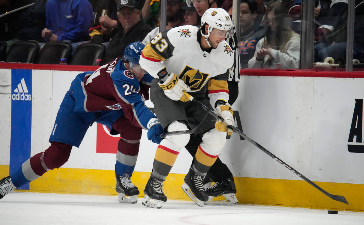 Vegas Golden Knights right wing Daniel D'Amato, right, collects the puck as Colorado Avalanche ...