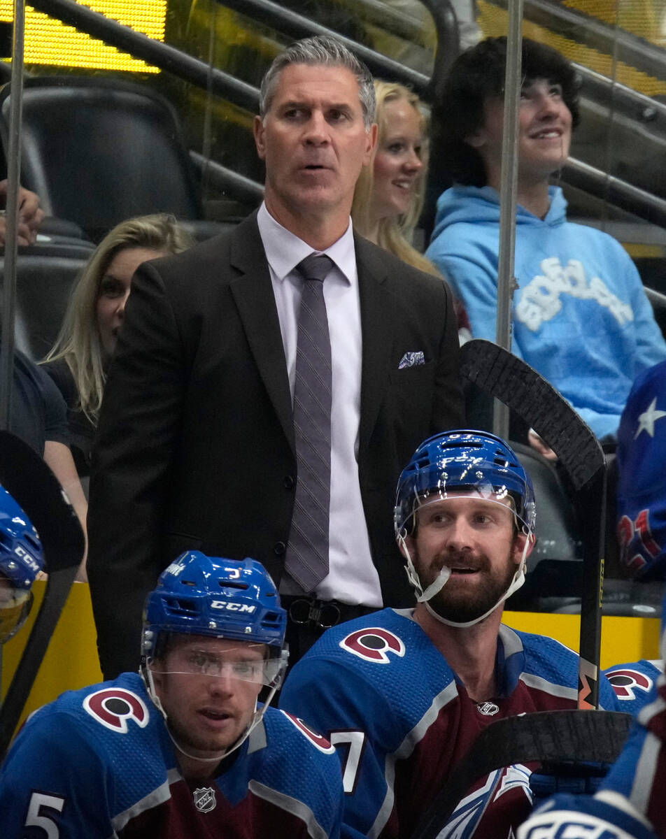 Colorado Avalanche head coach Jared Bednar, top, looks on from the team box in the second perio ...