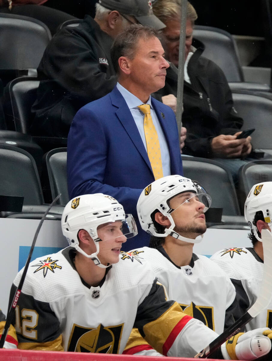 Vegas Golden Knights head coach Bruce Cassidy, top, looks on from the team box in the second pe ...