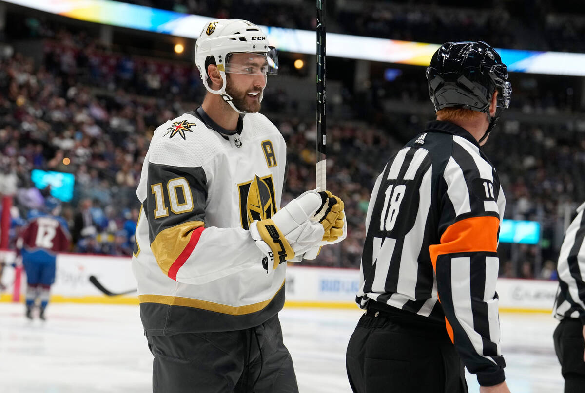 Vegas Golden Knights center Nicolas Roy, left, argues after he was called for a high stick by r ...