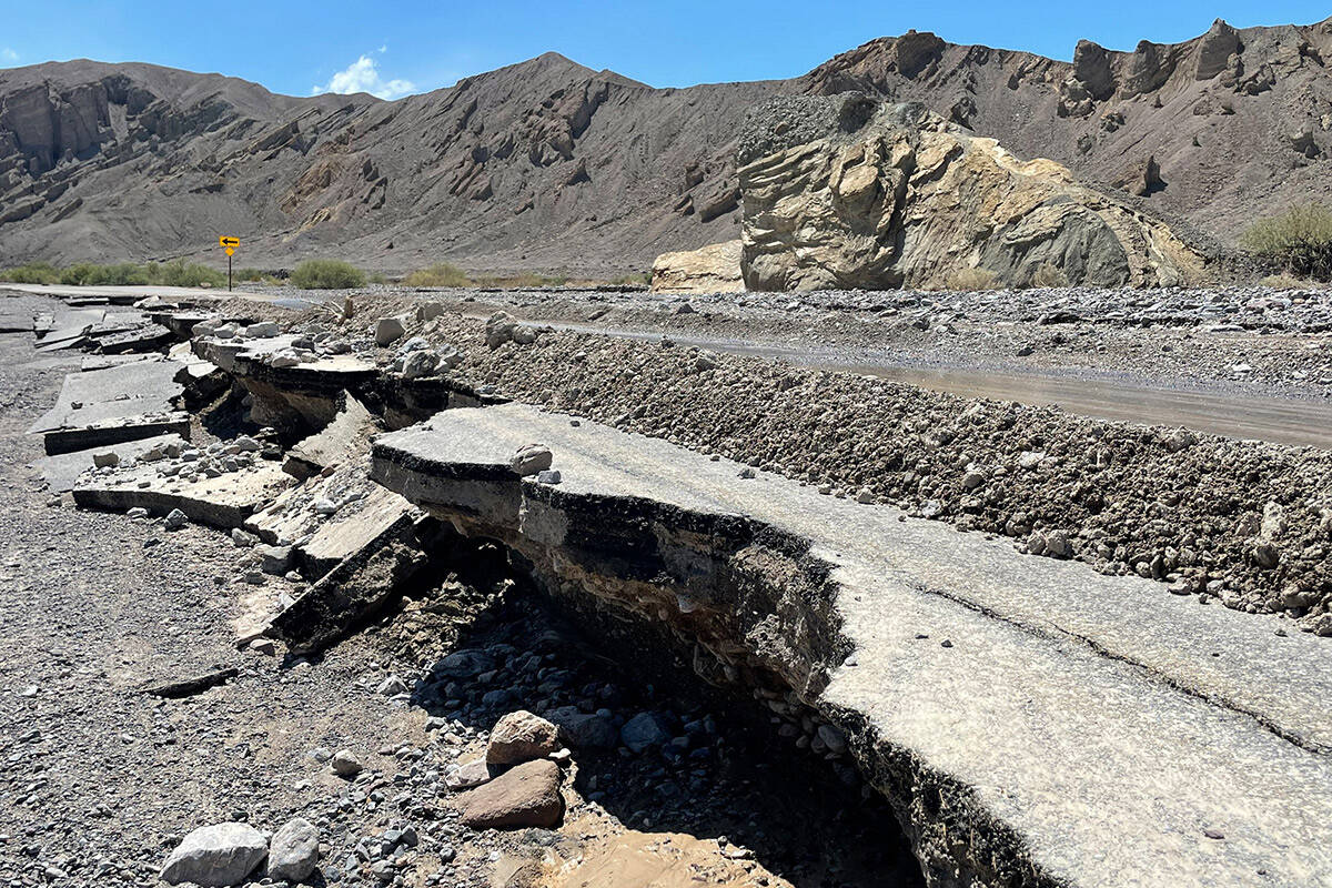 A damaged portion of state Route 190 east of Furnace Creek at Death Valley National Park in Cal ...