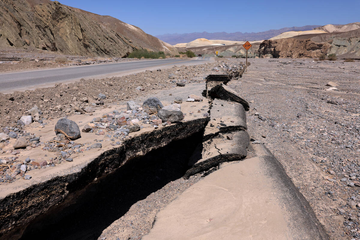 Damage from Tropical Storm Hilary is shown on state Route 190 on the way to Furnace Creek in De ...