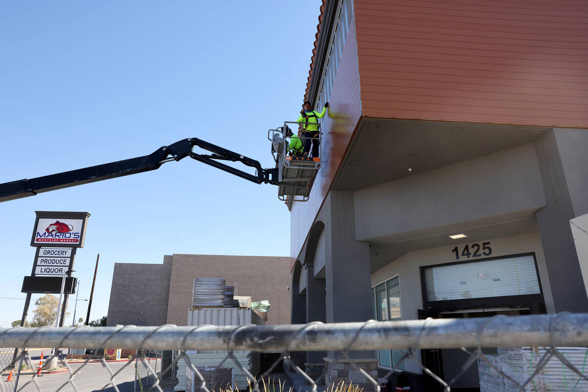 Workers put the finishing touches on the new Mario’s WestSide Market in Las Vegas on Mon ...