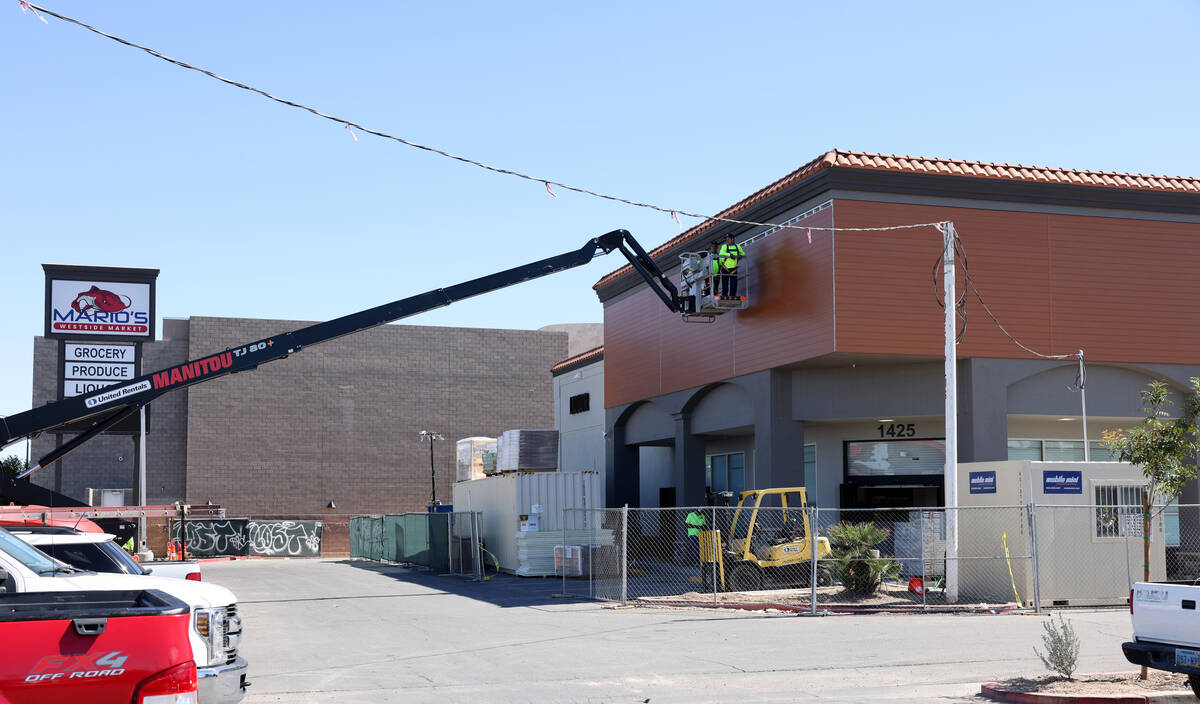 Workers put the finishing touches on the new Mario’s WestSide Market in Las Vegas on Mon ...