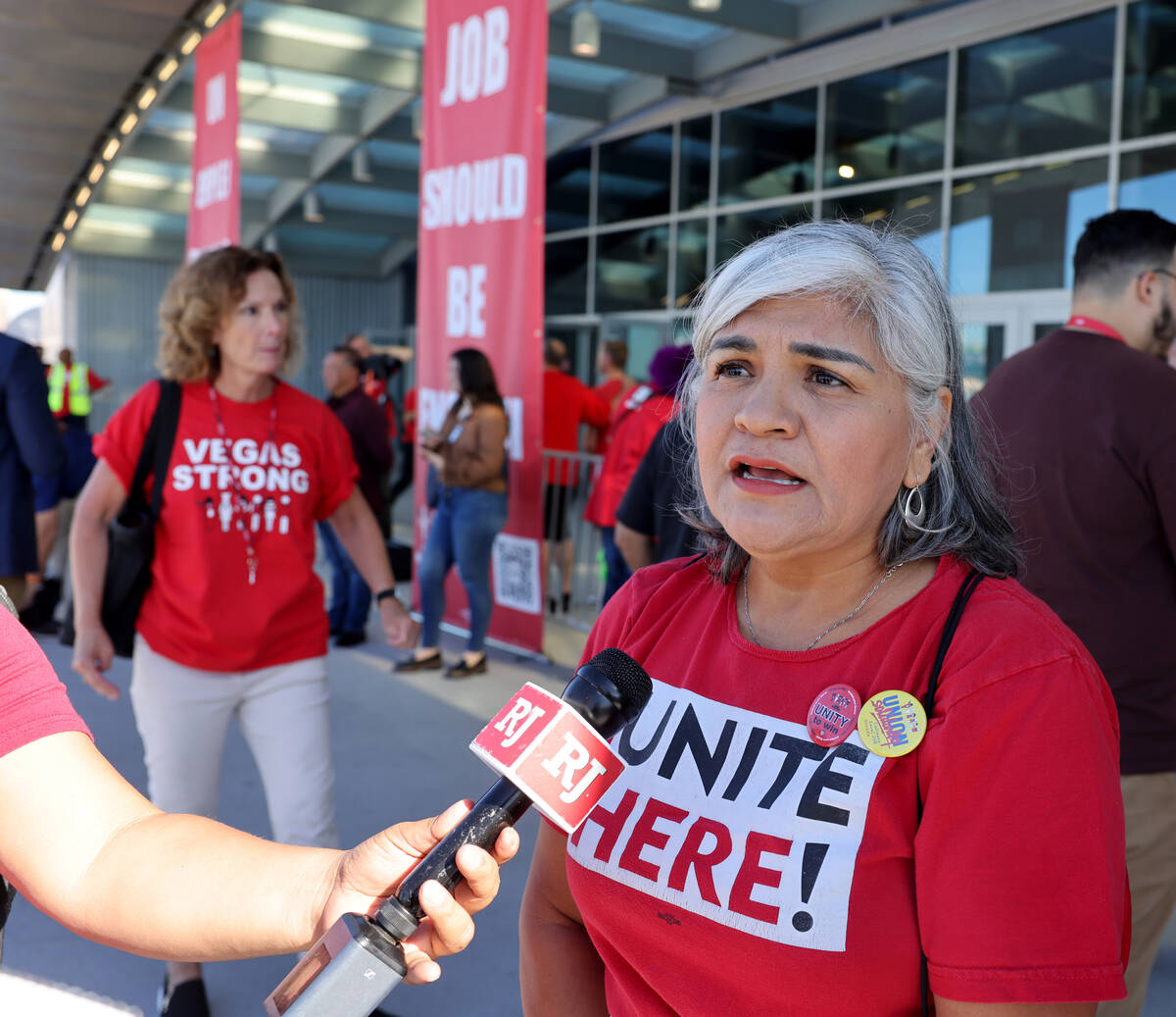 Caesars Palace porter Maria Espino talks to a reporter as fellow Culinary Union members file in ...