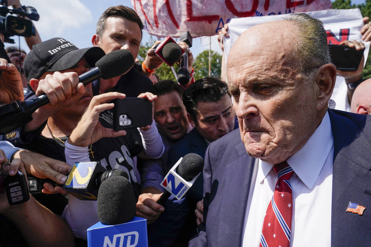 Rudy Giuliani speaks outside the Fulton County jail, Wednesday, Aug. 23, 2023, in Atlanta. Giul ...