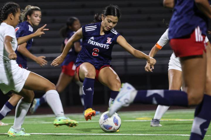 Liberty's Natalie Collins (2) maneuvers the ball against Desert Oasis during a soccer game at L ...