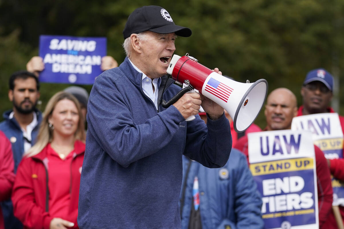 President Joe Biden joins striking United Auto Workers on the picket line, Tuesday, Sept. 26, 2 ...