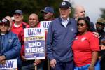 ‘Stick with it’: Biden joins striking auto workers in Michigan