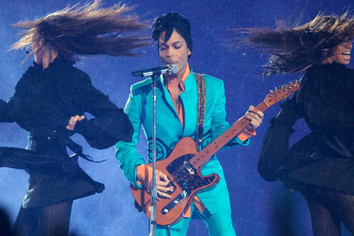 Prince performs during the halftime show at the Super Bowl XLI football game at Dolphin Stadium ...