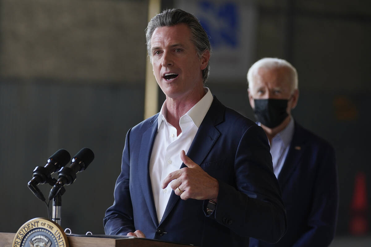 FILE - President Joe Biden listens as California Gov. Gavin Newsom speaks about recent wildfire ...