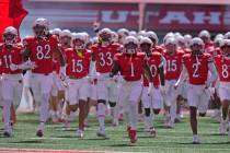 Utah players run on the field before an NCAA college football game against Utah Saturday, Sept. ...